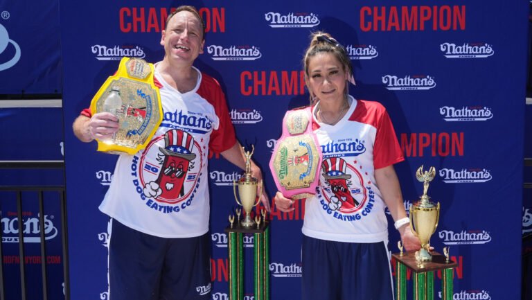 NEW YORK, NEW YORK - JULY 4: Winners Joey Chestnut and Miki Sudo at Nathan's Annual Hot Dog Eating Contest on July 4, 2025 in New York City. Joey Chestnut makes his return to the Nathan's Famous 4th of July Hot Dog Eating Contest to compete for a 17th win after missing the 2024 event due to a sponsorship dispute with Major League Eating. (Photo by Adam Gray/Getty Images)