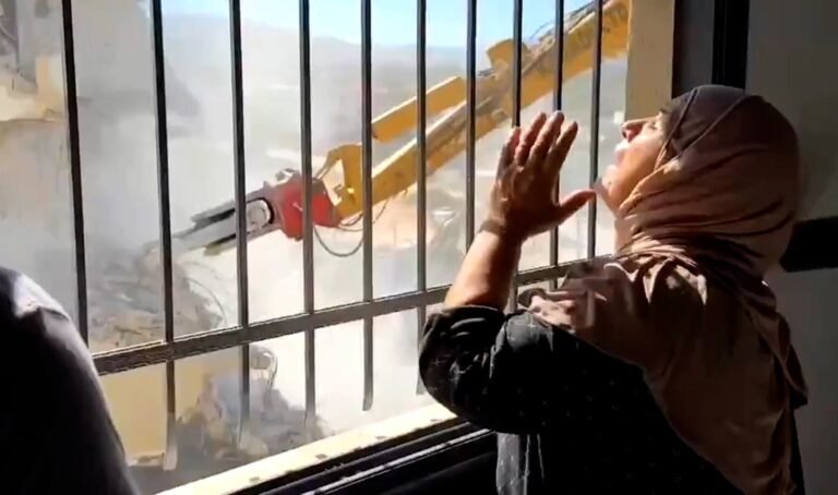 Palestinian woman watches Israel demolish home in occupied West Bank