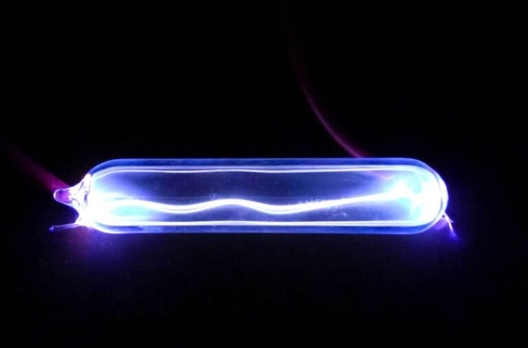Electricity lights up krypton gas, showing a plasma discharge.