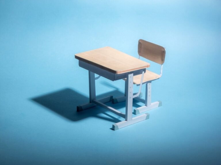 Empty school desk on a blue background. .
